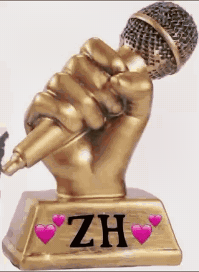 A Statue Of A Hand Holding A Microphone With The Name Zh On It GIF