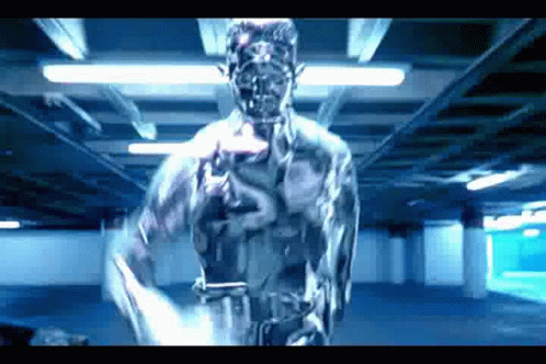 A Statue Of A Man Is Standing In A Dark Room With A Gun In His Hand . GIF