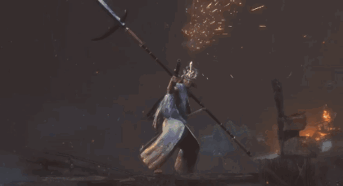 A Statue Of A Man Is Surrounded By Flames GIF