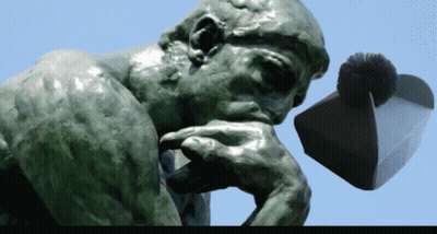 A Statue Of A Man Thinking With His Hand On His Chin And A Hat In The Background GIF