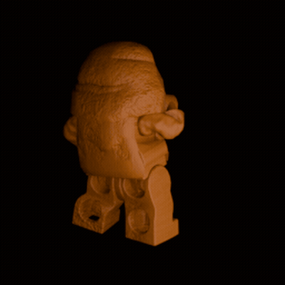 A Statue Of A Man With A Beard Is Standing In A Dark Room GIF