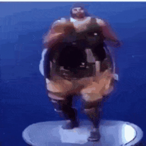 A Statue Of A Man With A Beard Is Standing On A Pedestal In The Water . GIF