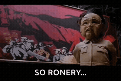 A Statue Of A Man With Glasses Is Standing In Front Of A Painting Of Soldiers And The Words `` So Ronery '' GIF