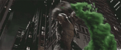 A Statue Of A Monster Is Surrounded By Green Smoke Coming Out Of It 'S Mouth . GIF