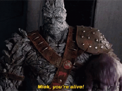 A Statue Of A Monster Says " Miek You 'Re Alive ! " GIF