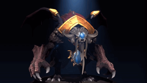 A Statue Of A Monster With Horns And A Blue Jewel In Its Mouth GIF