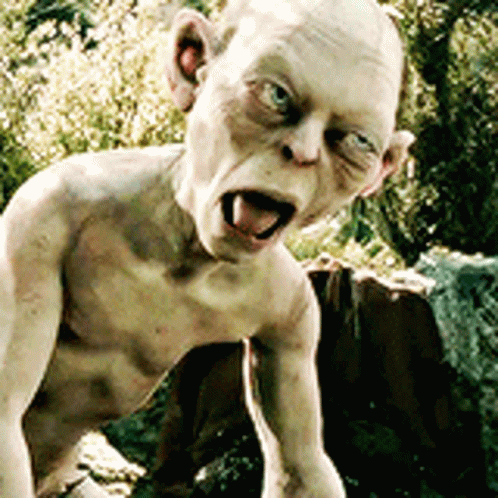 A Statue Of A Naked Man With His Tongue Out GIF