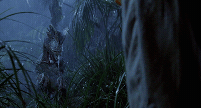 A Statue Of A Rabbit Is Standing In The Grass GIF