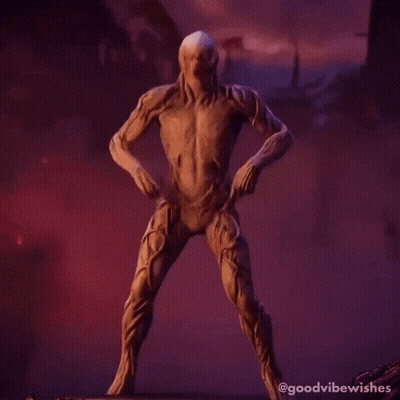 A Statue Of A Skeleton Making A Peace Sign With His Hands GIF