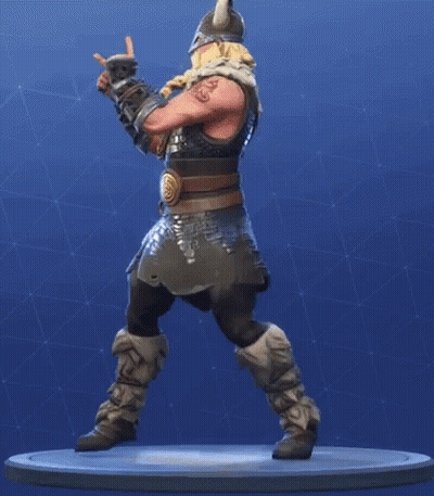 A Statue Of A Viking Wearing A Horned Helmet And A Beard Is Standing On A Pedestal . GIF