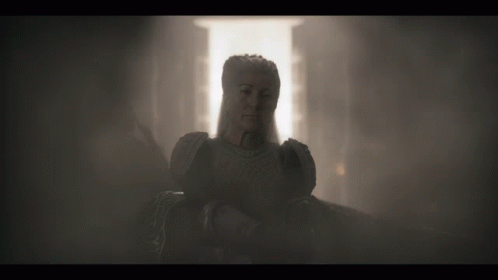 A Statue Of A Woman In A Dark Room GIF