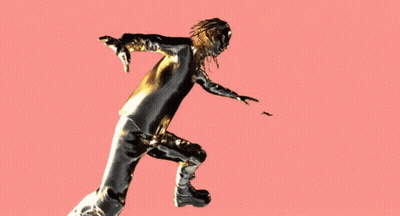 A Statue Of A Woman With Gold And Black Paint On Her Body GIF