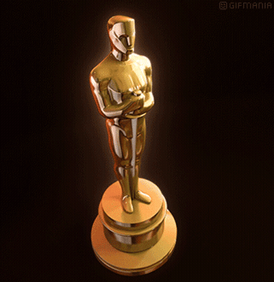 A Statue Of An Oscar Winner On A Pedestal With Gifmania Written On The Bottom GIF