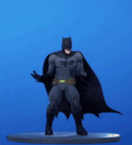 A Statue Of Batman Is Standing On A Blue Background GIF