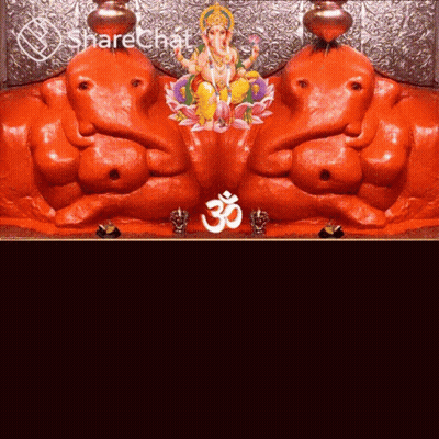 A Statue Of Ganesha And A Statue Of A Deity With An O Symbol GIF