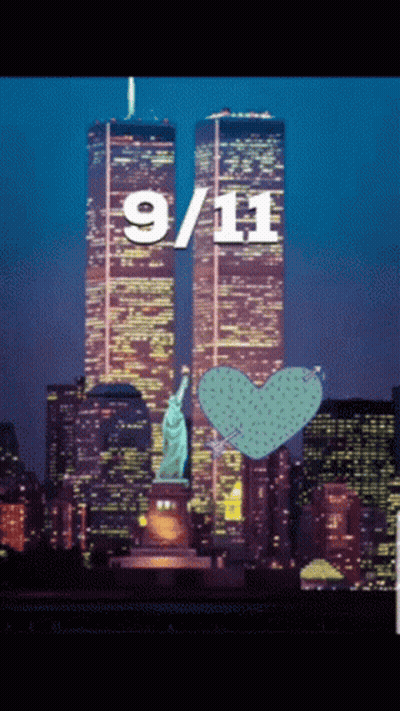 A Statue Of Liberty Stands In Front Of The Twin Towers On September 11Th GIF