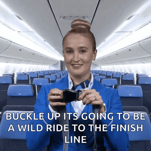 A Stewardess In A Blue Suit Is Holding A Seat Belt Buckle Up GIF