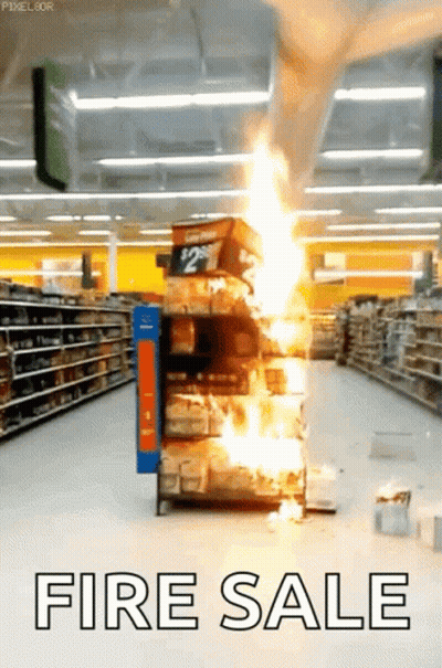 A Store Aisle With A Fire Sale Sign GIF