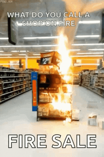 A Store Aisle With A Stack Of Boxes On Fire And The Words " What Do You Call A Shop On Fire Fire Sale " GIF