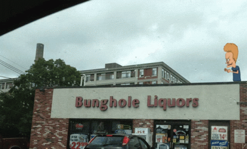 A Store Called Bunghole Liquors Has A Cartoon Character On Top GIF