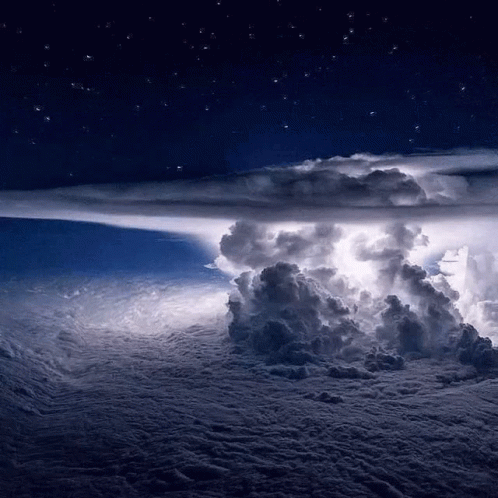 A Storm Is Brewing In The Night Sky With A Lot Of Clouds GIF