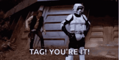 A Storm Trooper Is Standing In Front Of Han Solo . GIF
