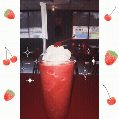 A Strawberry Milkshake With Whipped Cream And A Cherry On Top Of It GIF