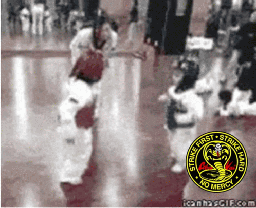A Strike First Strike Hard No Mercy Logo Is On A Red Background GIF