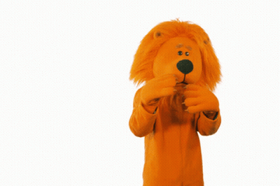 A Stuffed Animal In An Orange Lion Costume Covering Its Mouth GIF