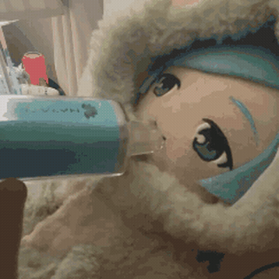 A Stuffed Animal Is Drinking From A Syringe GIF