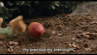 A Stuffed Animal Is Laying On The Ground With The Words My Precious My Precious !!! GIF