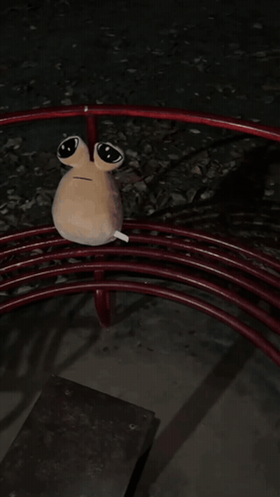 A Stuffed Animal Is Laying On Top Of A Red Swirl GIF