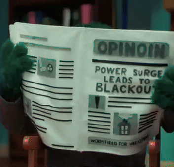 A Stuffed Animal Is Reading A Newspaper That Says Opinion On It GIF
