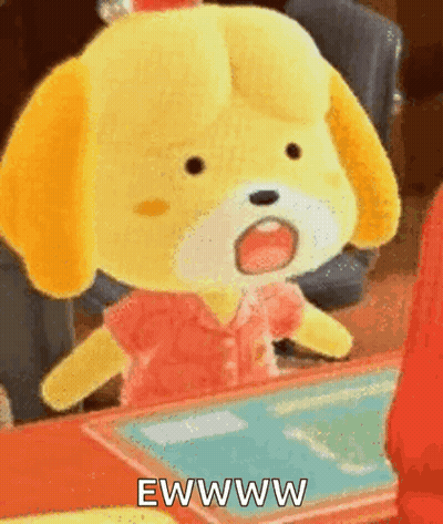 A Stuffed Animal Is Sitting At A Table With Its Mouth Open And The Words Ewww Written On It . GIF