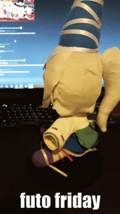 A Stuffed Animal Is Sitting In Front Of A Computer Screen With The Words Futo Friday Below It GIF