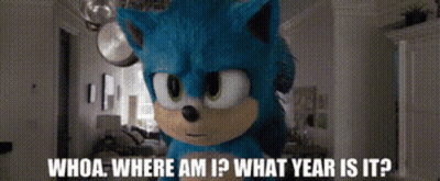 A Stuffed Animal Of Sonic The Hedgehog Is Standing In A Room And Asking Whoa Where Am I What Year Is It GIF