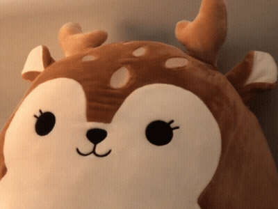 A Stuffed Animal That Looks Like A Deer With Antlers On It GIF