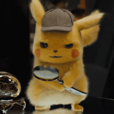 A Stuffed Animal Wearing A Detective Hat Holds A Magnifying Glass GIF