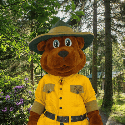 A Stuffed Animal Wearing A Hat And A Yellow Shirt That Says Bello GIF