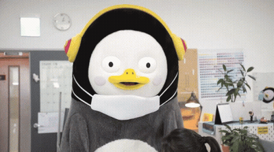 A Stuffed Animal Wearing A Mask And Headphones GIF
