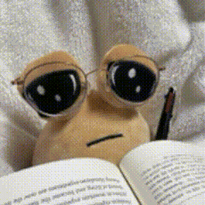 A Stuffed Animal Wearing Glasses Is Reading A Book With A Pen GIF