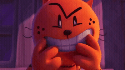 A Stuffed Animal With A Big Smile On Its Face Is Making A Funny Face . GIF