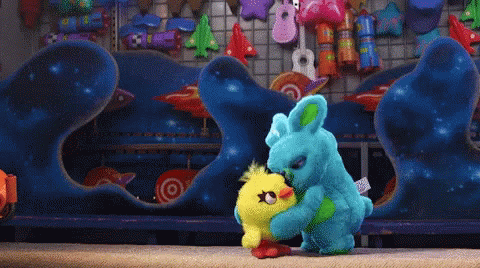 A Stuffed Animal With A Tag That Says " Bunny " On It GIF