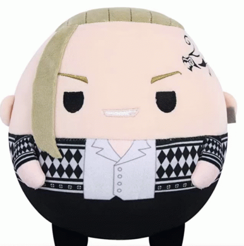 A Stuffed Animal With A Tattoo On His Forehead Is Sitting On A Table GIF