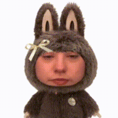 A Stuffed Animal With Bunny Ears And A Bow GIF
