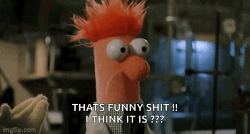 A Stuffed Animal With Red Hair And Big Eyes Is Talking About Something Funny . GIF