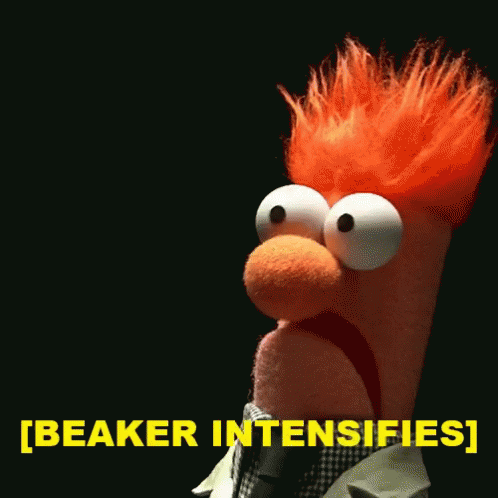 A Stuffed Animal With Red Hair Says Beaker Intensifies In Yellow GIF
