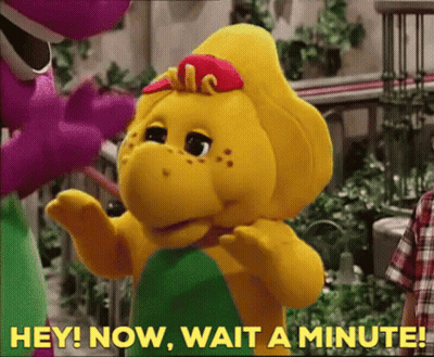 A Stuffed Animal With The Words Hey Now Wait A Minute Written On It GIF