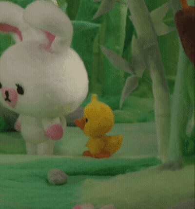 A Stuffed Bunny And A Stuffed Duck Are Standing Next To Each Other In The Grass GIF