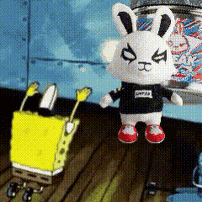 A Stuffed Bunny Wearing A Black Shirt With The Word Spongebob On It Is Standing Next To A Spongebob Doll GIF